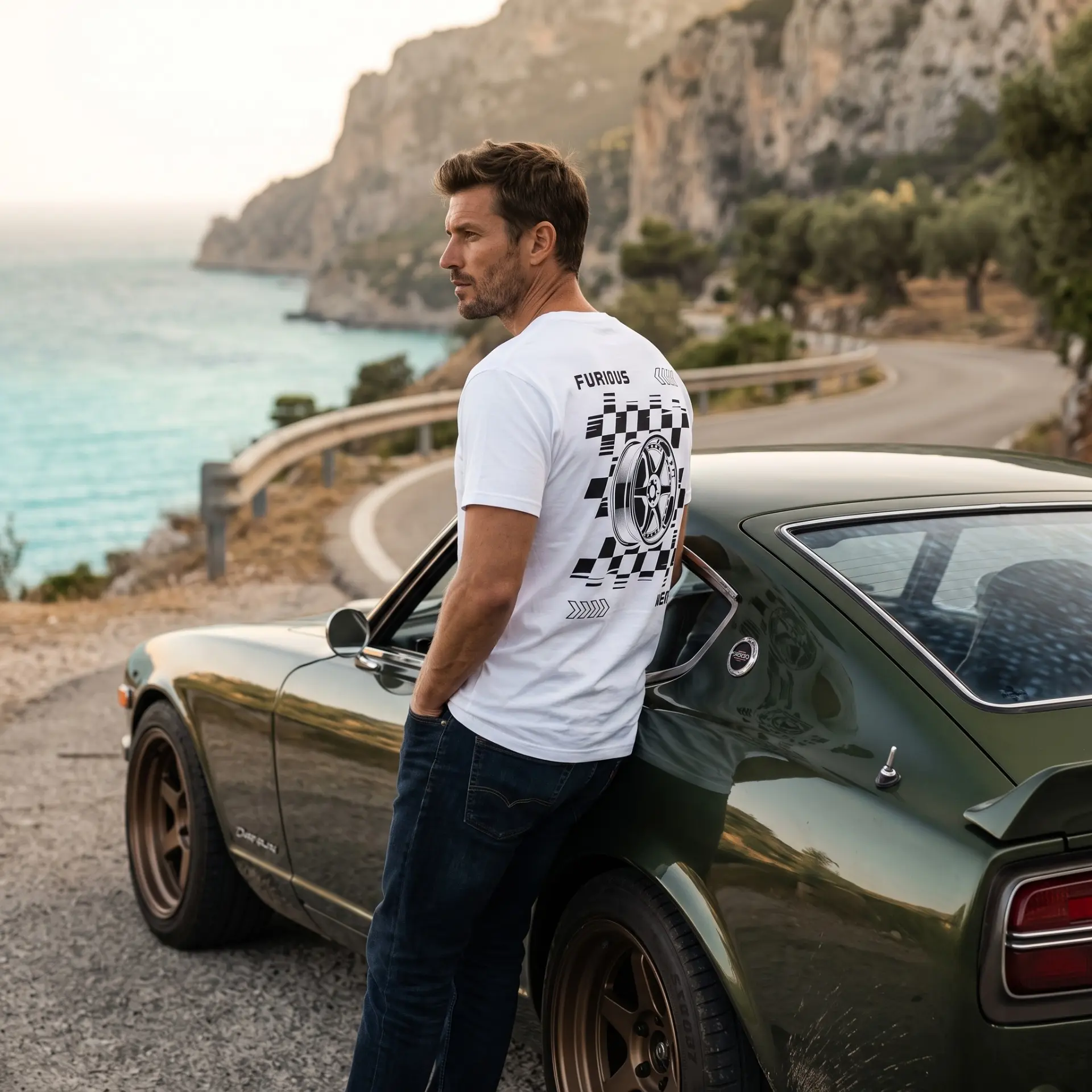 Model by a classic sports car wearing the white Furious Wear wheel back-print tee
